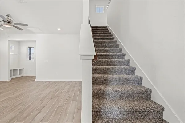 a view of an entryway with wooden floor