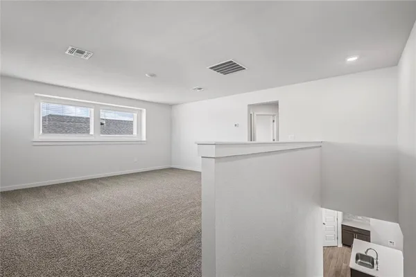 a view of a kitchen with closet and window