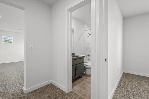 a view of a kitchen from the hallway