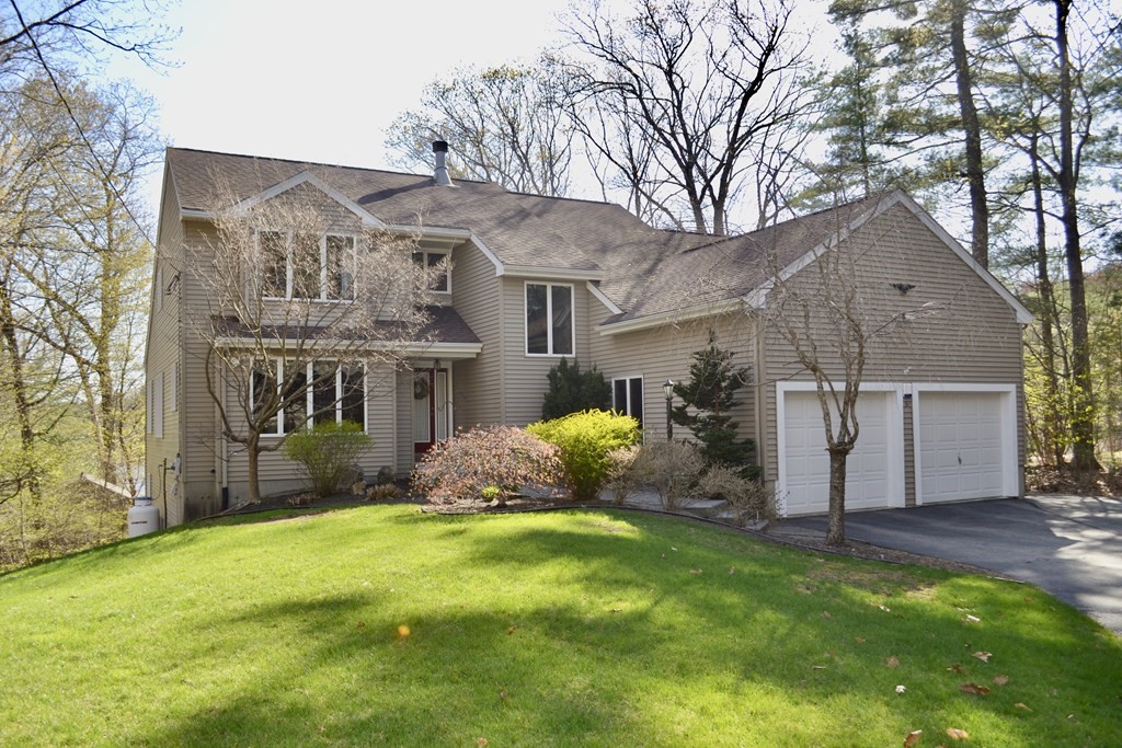 38 Lincoln Point Road Charlton, MA 01507 - Photo 1 of 25 a front view of house with yard and green space