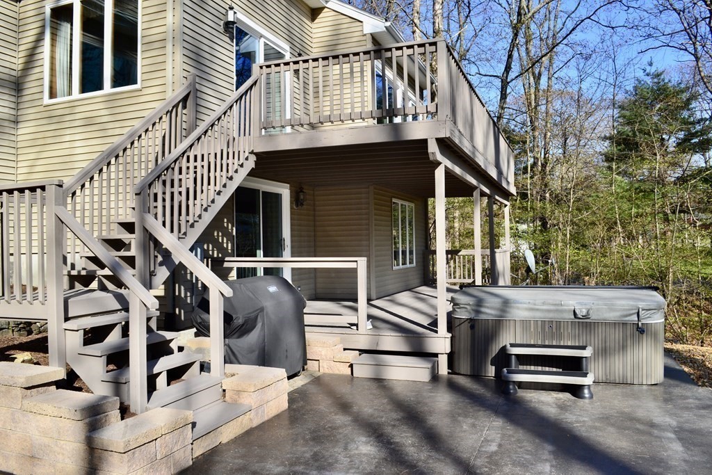 38 Lincoln Point Road Charlton, MA 01507 - Photo 2 of 25 a view of a patio with table and chairs with wooden floor and fence