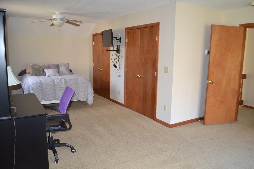 38 Lincoln Point Road Charlton, MA 01507 - Photo 23 of 25 a view of a livingroom with furniture and a ceiling fan