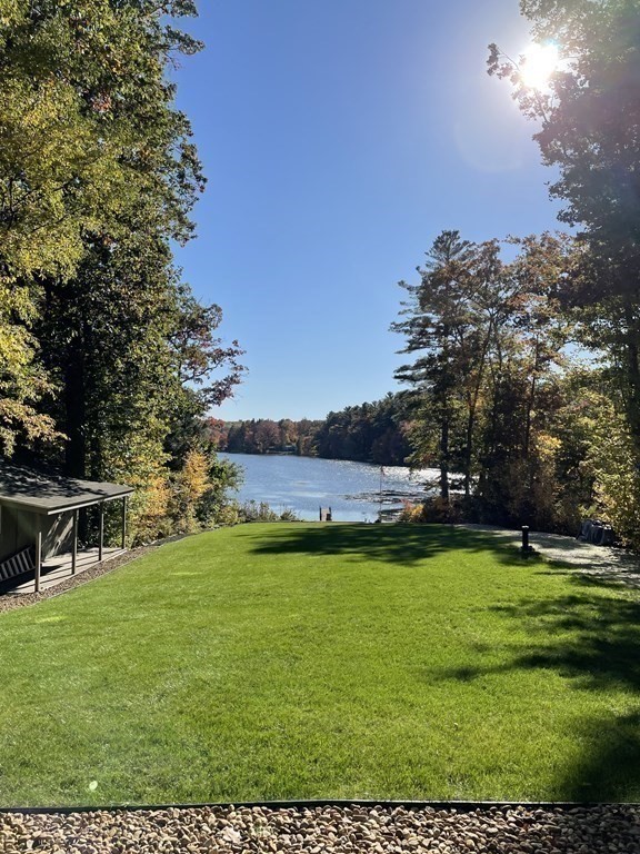 38 Lincoln Point Road Charlton, MA 01507 - Photo 5 of 25 a view of a lake with a building in the background