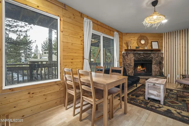 a view of a dining room with furniture wooden floor and chandelier