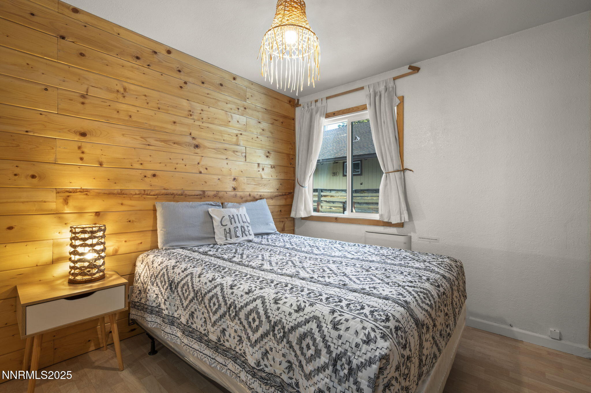 255 Tramway Drive, Unit 1B Stateline, NV 89449 - Photo 20 of 22 a bedroom with a bed and a window