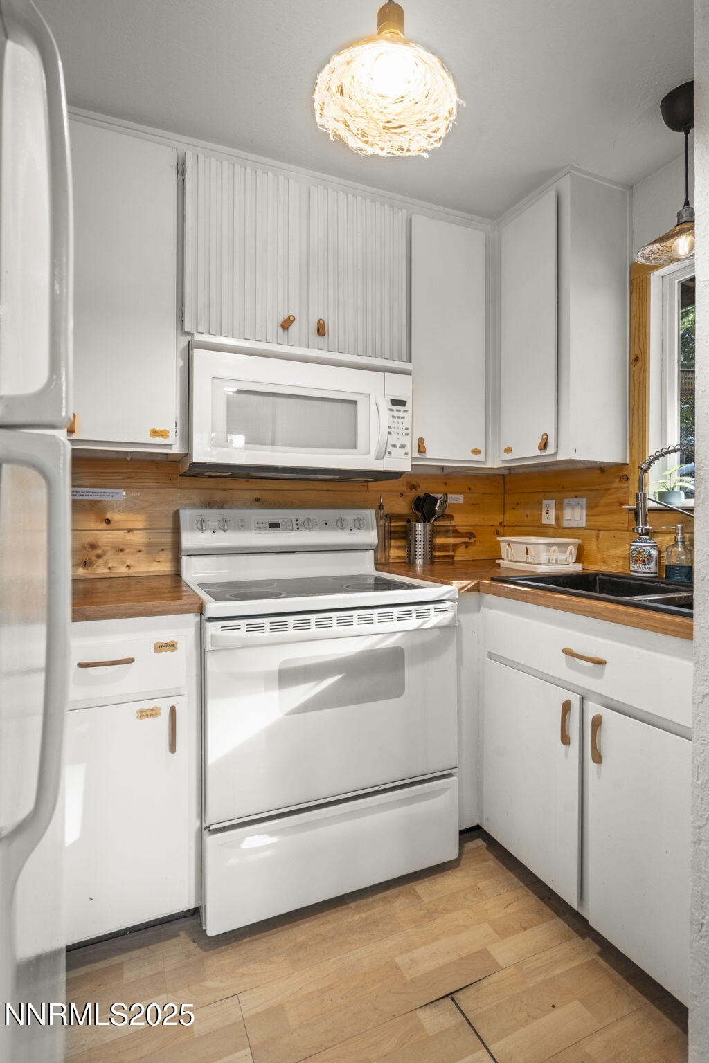 255 Tramway Drive, Unit 1B Stateline, NV 89449 - Photo 8 of 22 a kitchen with appliances cabinets and a sink