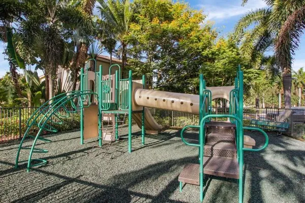 an outdoor space with seating area and trees