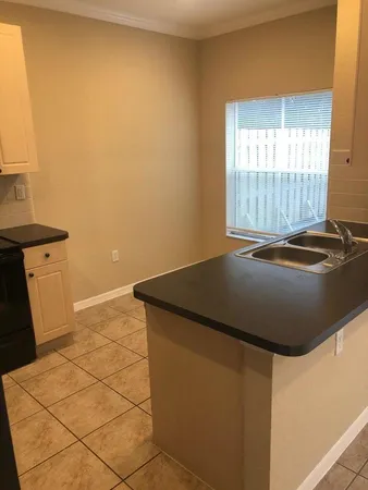 a view of a kitchen with a sink