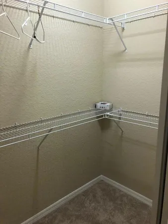 a view of a room with racks on the wall