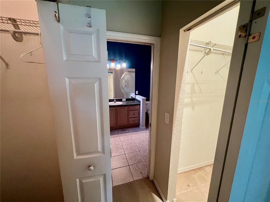11097 Southwest 69th Circle Ocala, FL 34476 - Photo 12 of 16 a view of a hallway and an entryway with livingroom