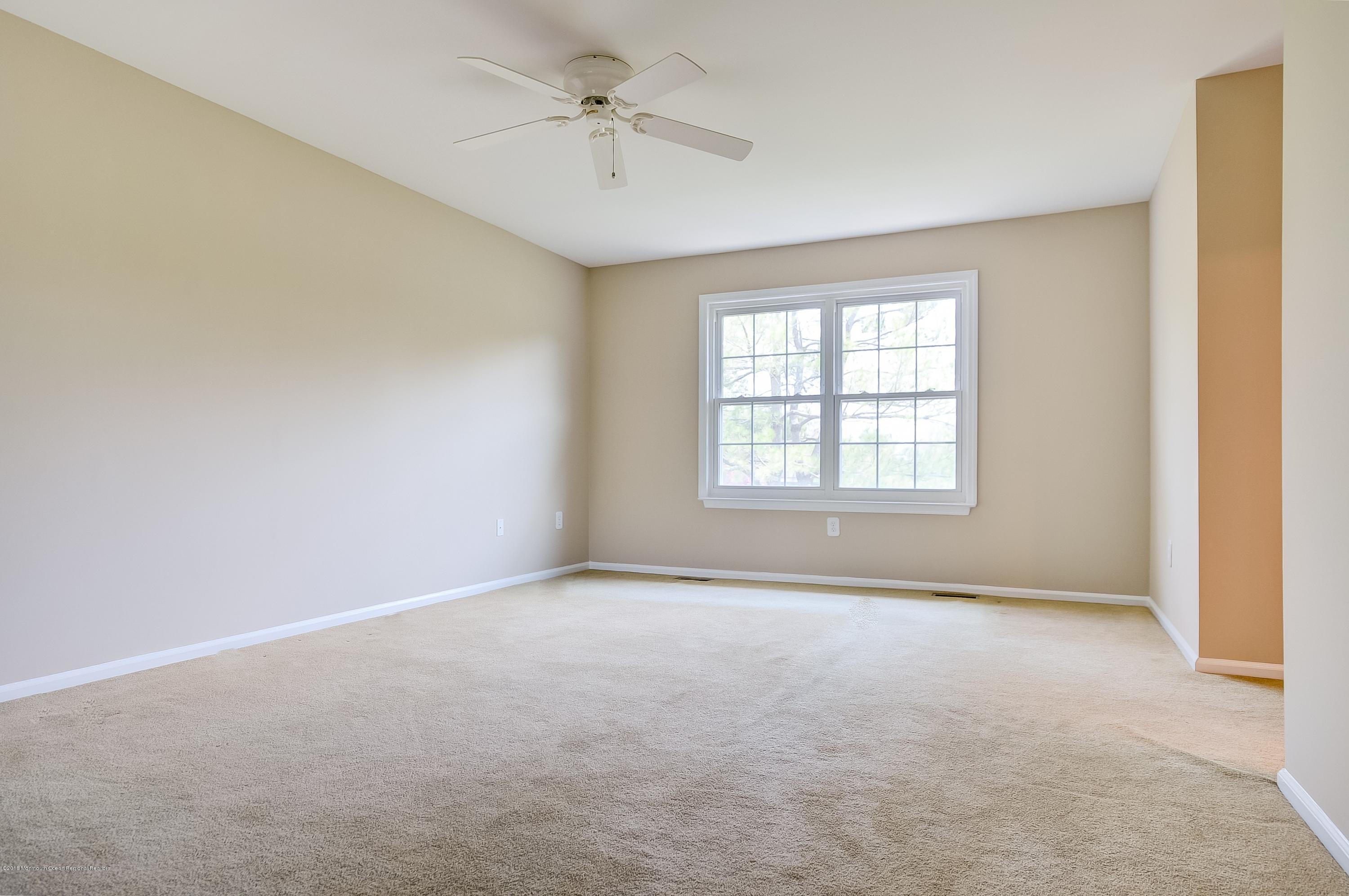 41 Apple Drive Spring Lake Heights, NJ 07762 - Photo 12 of 32 a view of an empty room with a window