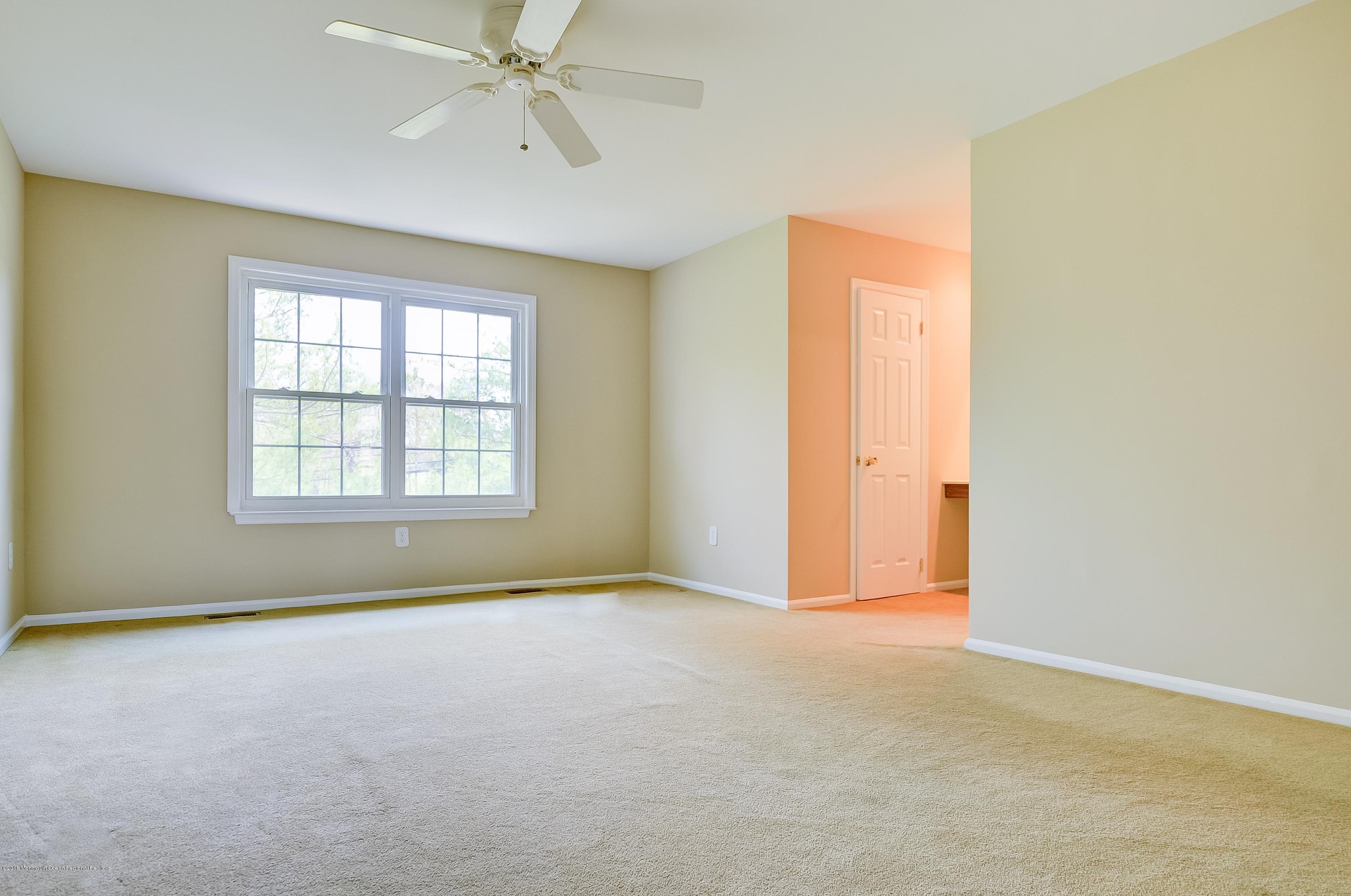 41 Apple Drive Spring Lake Heights, NJ 07762 - Photo 13 of 32 an empty room with a empty space and windows