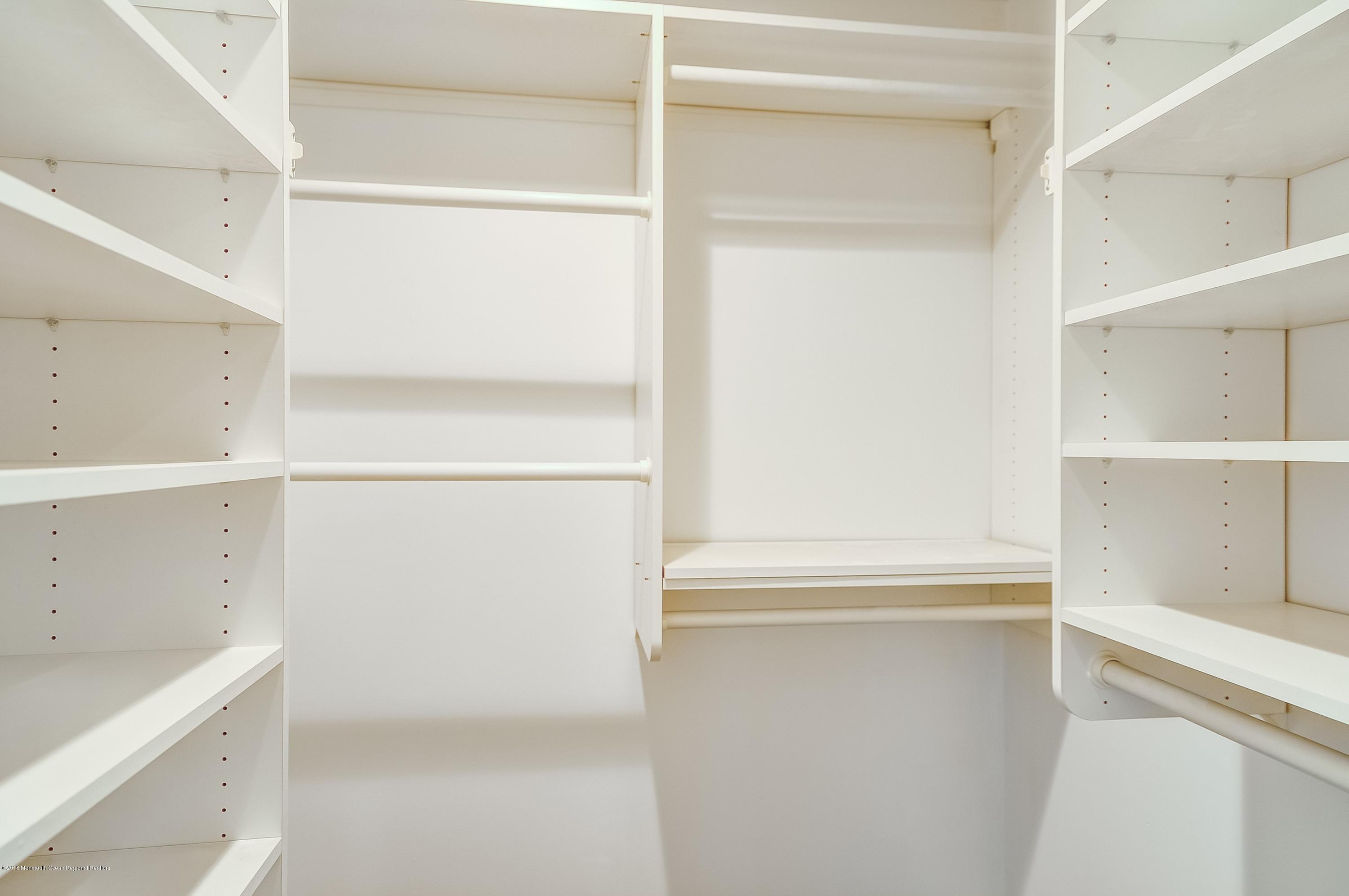 41 Apple Drive Spring Lake Heights, NJ 07762 - Photo 17 of 32 a view of walk in closet with empty racks