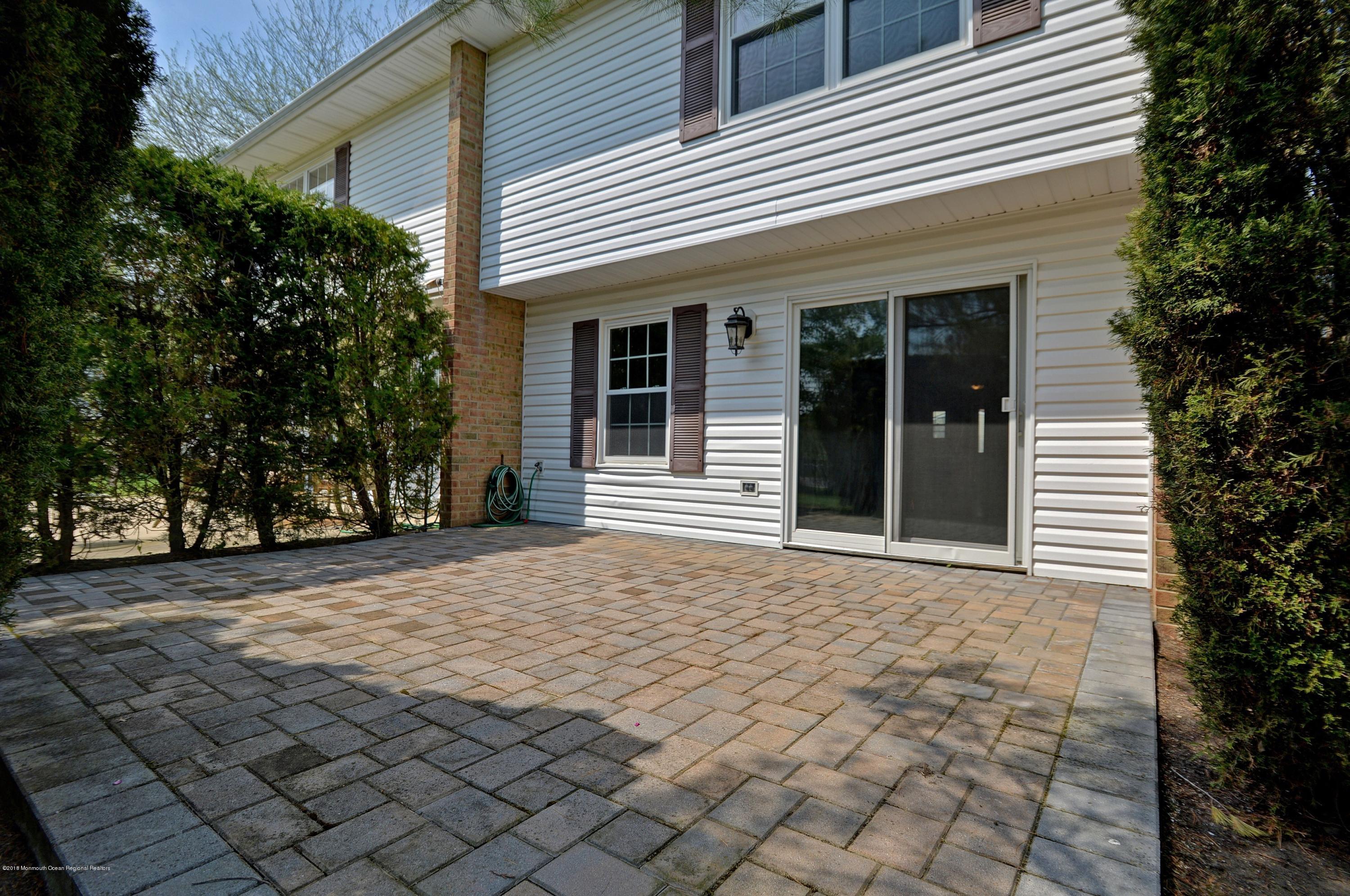 41 Apple Drive Spring Lake Heights, NJ 07762 - Photo 24 of 32 a front view of a house with a yard