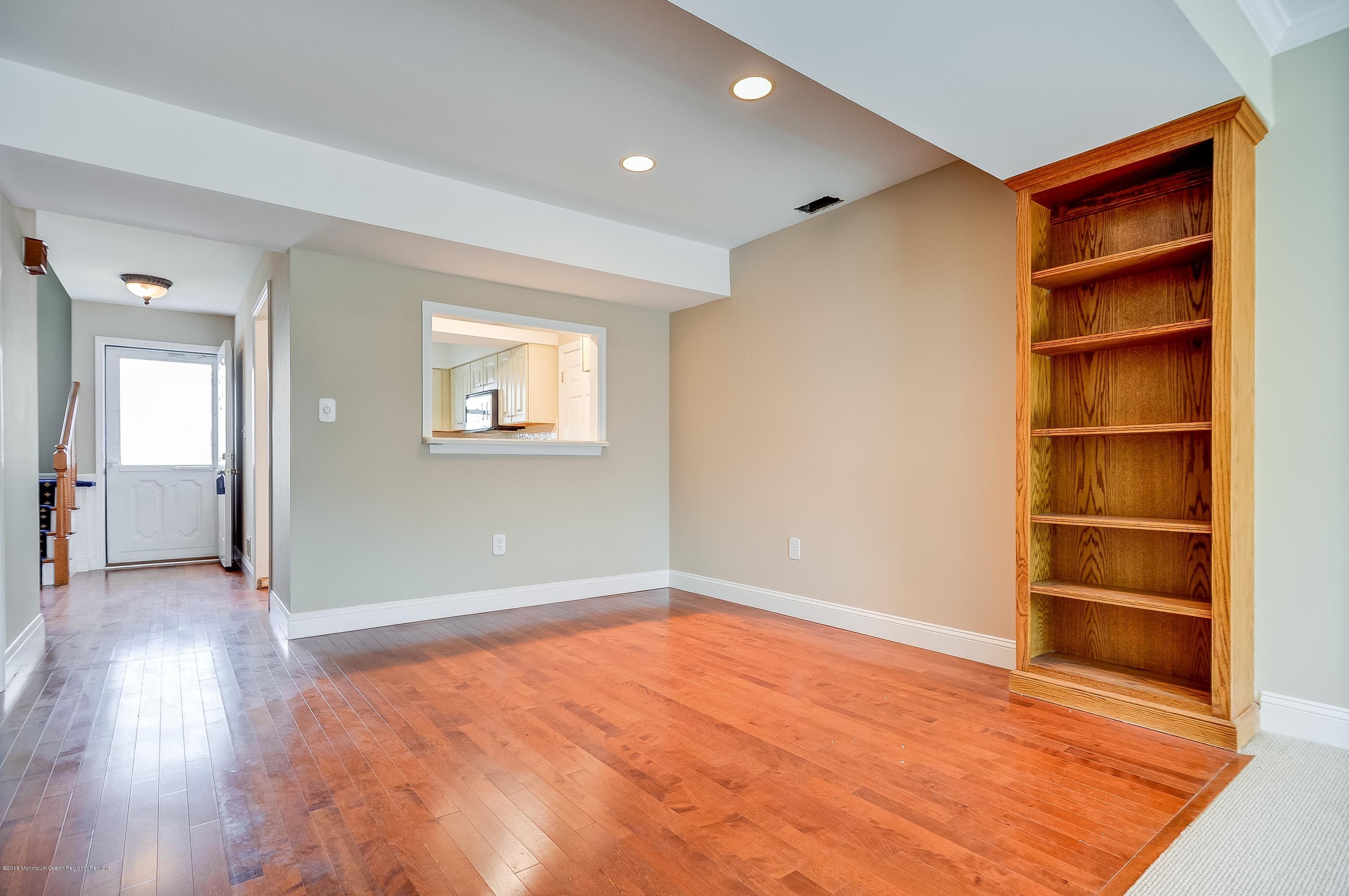 41 Apple Drive Spring Lake Heights, NJ 07762 - Photo 3 of 32 an empty room with wooden floor and closet