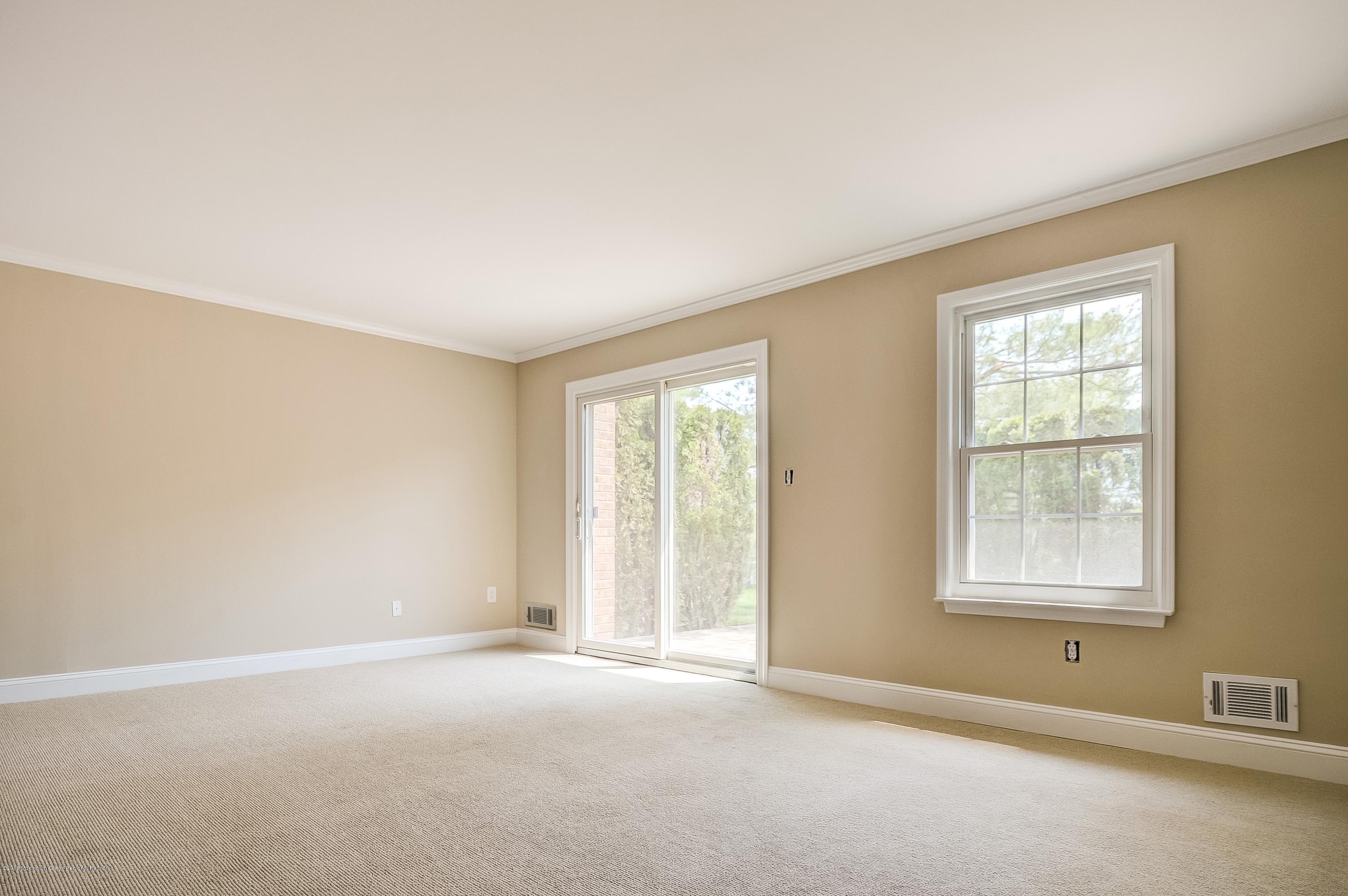 41 Apple Drive Spring Lake Heights, NJ 07762 - Photo 7 of 32 an empty room with a window