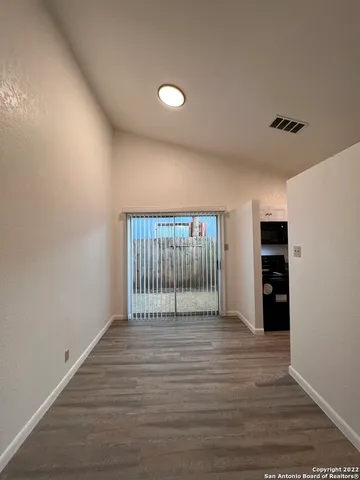 a view of a livingroom with wooden floor