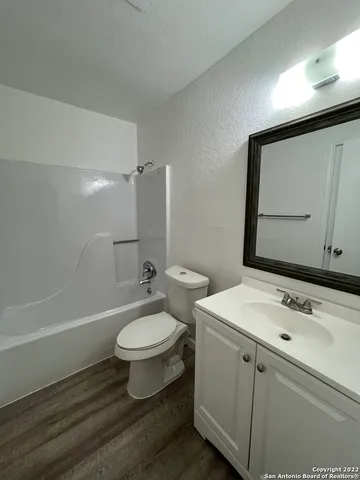 a bathroom with a sink a toilet and a bathtub