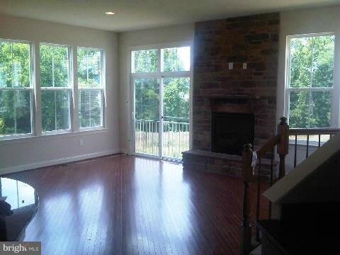 9839 Garden Ranges Laurel, MD 20723 - Photo 11 of 12 a view of an empty room with wooden floor and a window
