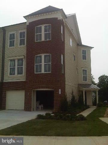 9839 Garden Ranges Laurel, MD 20723 - Photo 9 of 12 a front view of a house with yard