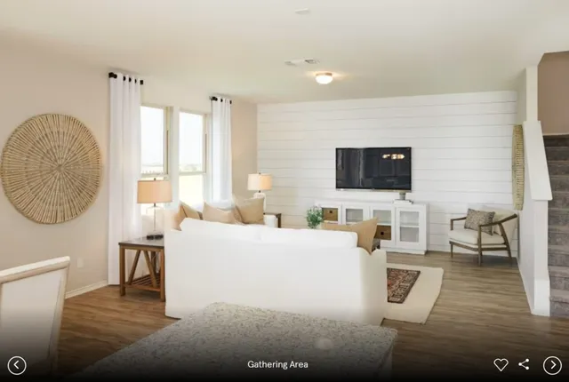 a view of a dining room with furniture and window