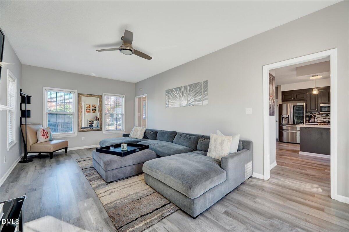 6900 Whittlesea Place Raleigh, NC 27616 - Photo 12 of 39 a living room with furniture and wooden floor