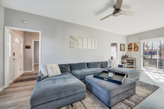 a living room with furniture and a rug