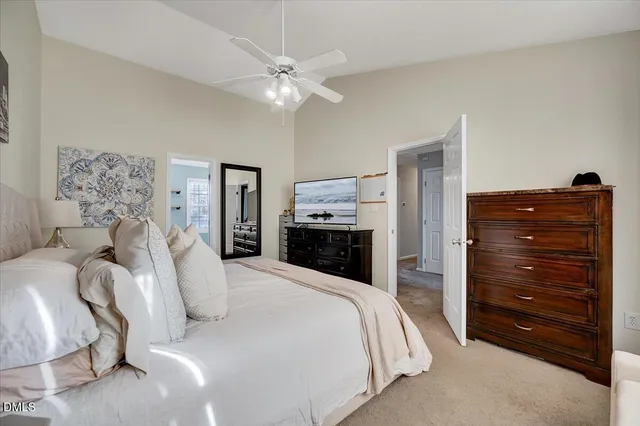 a bedroom with a bed and a mirror