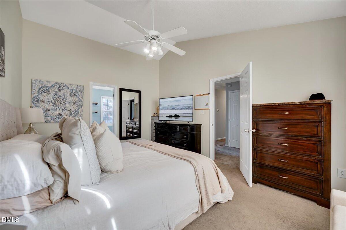 6900 Whittlesea Place Raleigh, NC 27616 - Photo 18 of 39 a bedroom with a bed and a mirror