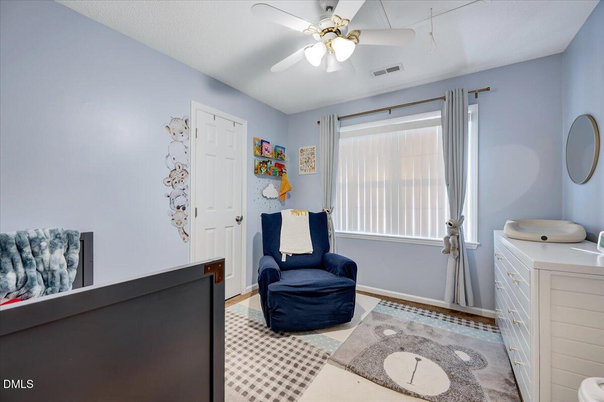 6900 Whittlesea Place Raleigh, NC 27616 - Photo 25 of 39 a bathroom with a sink a toilet and a window