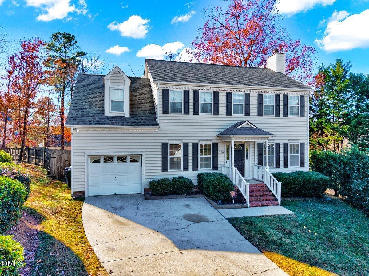 6900 Whittlesea Place Raleigh, NC 27616 - Photo 2 of 39 a front view of a house with a yard and garage