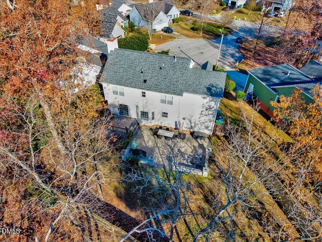 an aerial view of a house with a yard