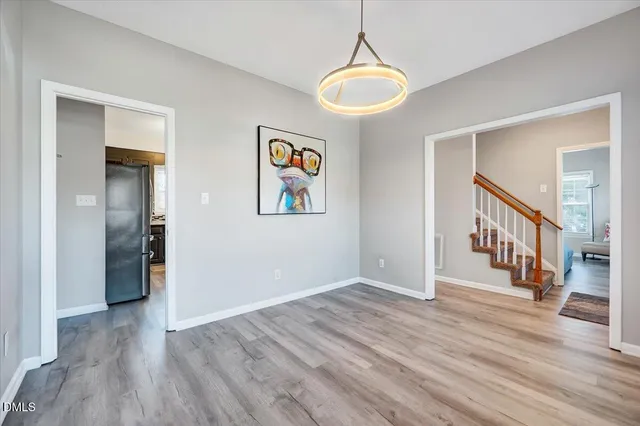 a view of an entryway with wooden floor