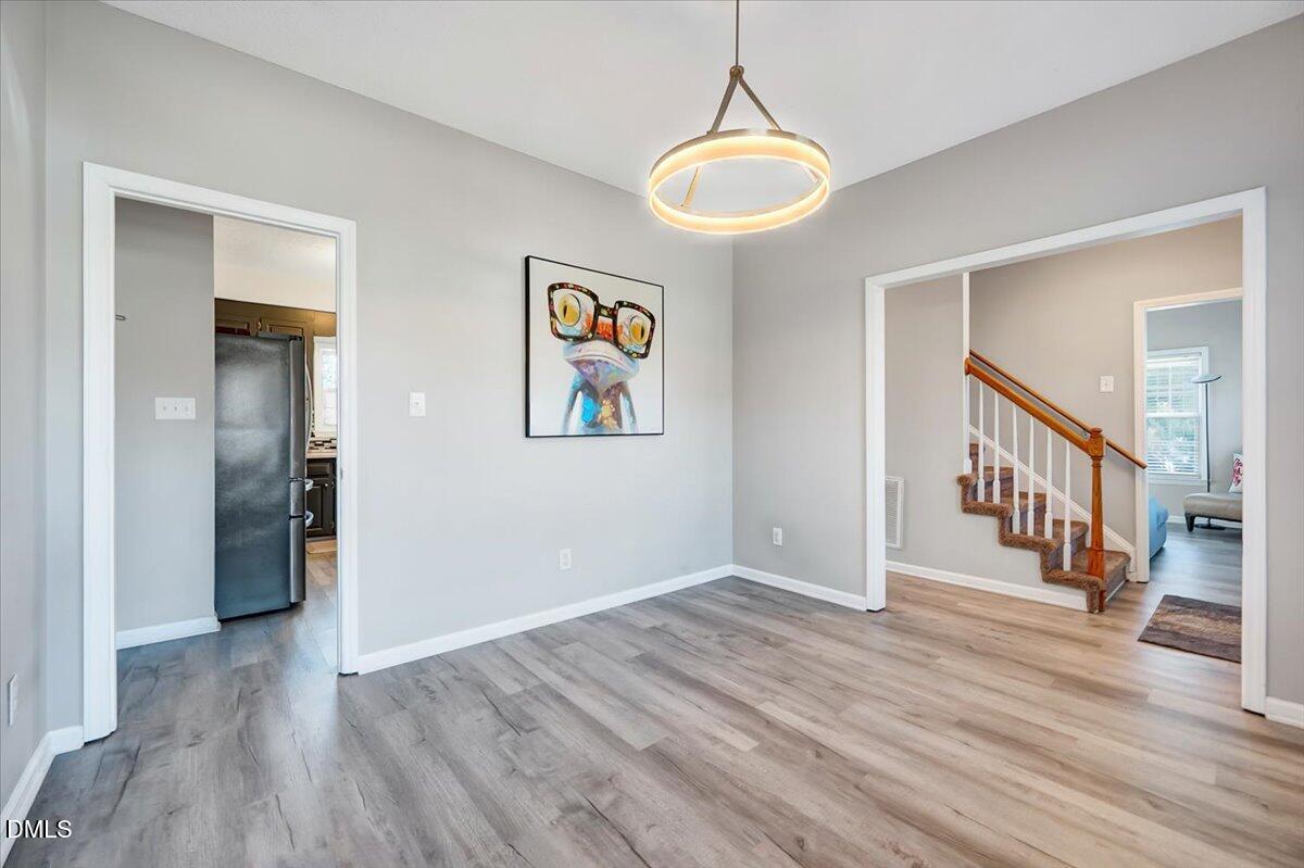 6900 Whittlesea Place Raleigh, NC 27616 - Photo 9 of 39 a view of an entryway with wooden floor