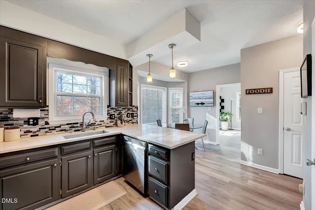 a kitchen with a sink stove and refrigerator