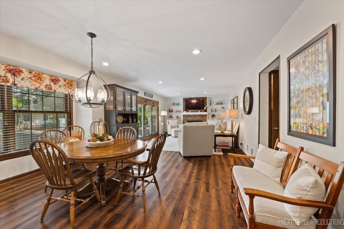 78 South Stauffer Drive Naperville, IL 60540 - Photo 15 of 31 a dining room with furniture a chandelier and wooden floor