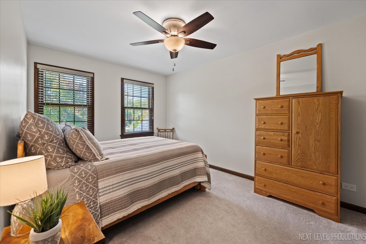78 South Stauffer Drive Naperville, IL 60540 - Photo 23 of 31 a bedroom with a bed and a dresser