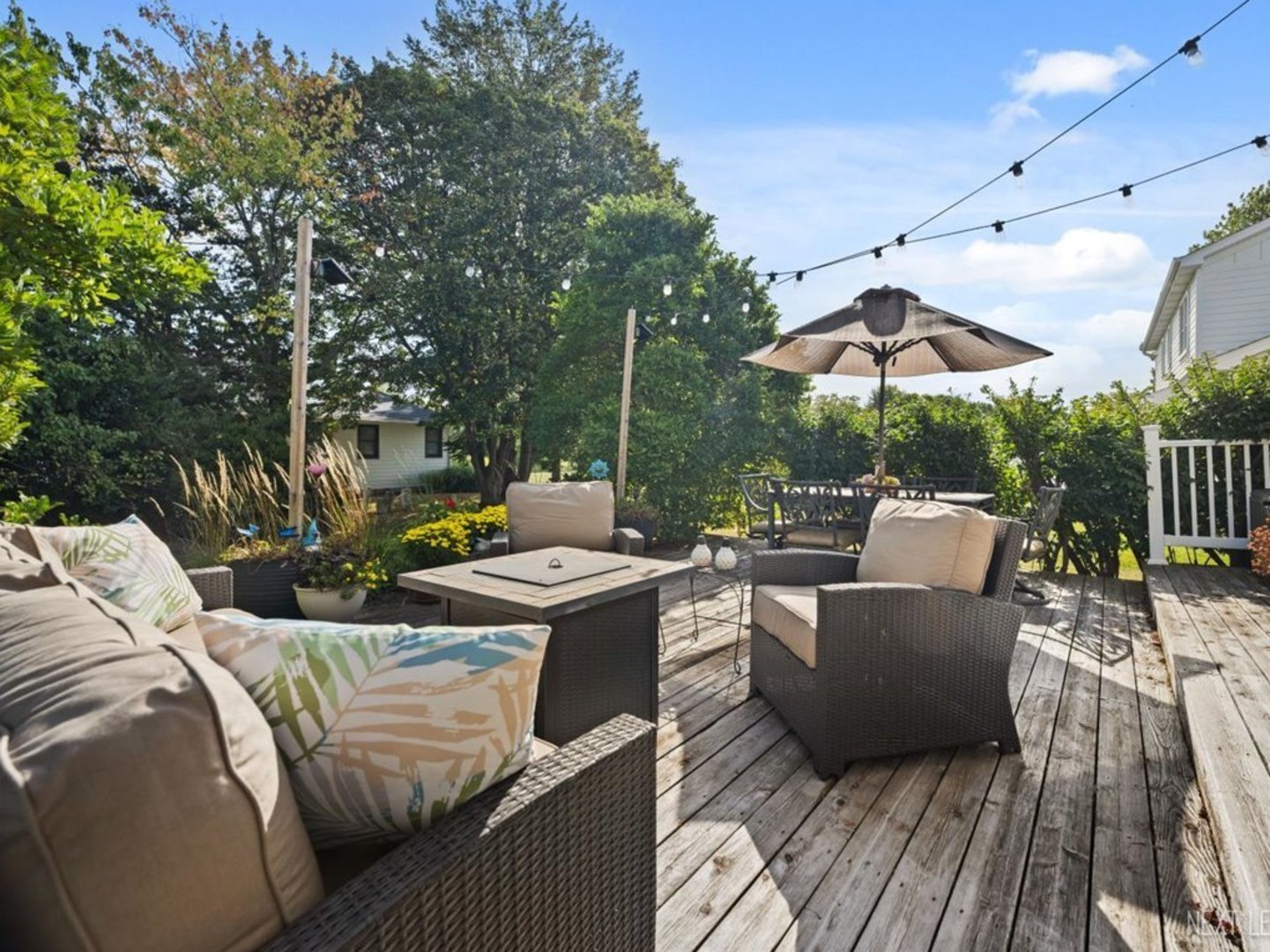 78 South Stauffer Drive Naperville, IL 60540 - Photo 30 of 31 a view of a patio with couches and table and chairs with wooden floor