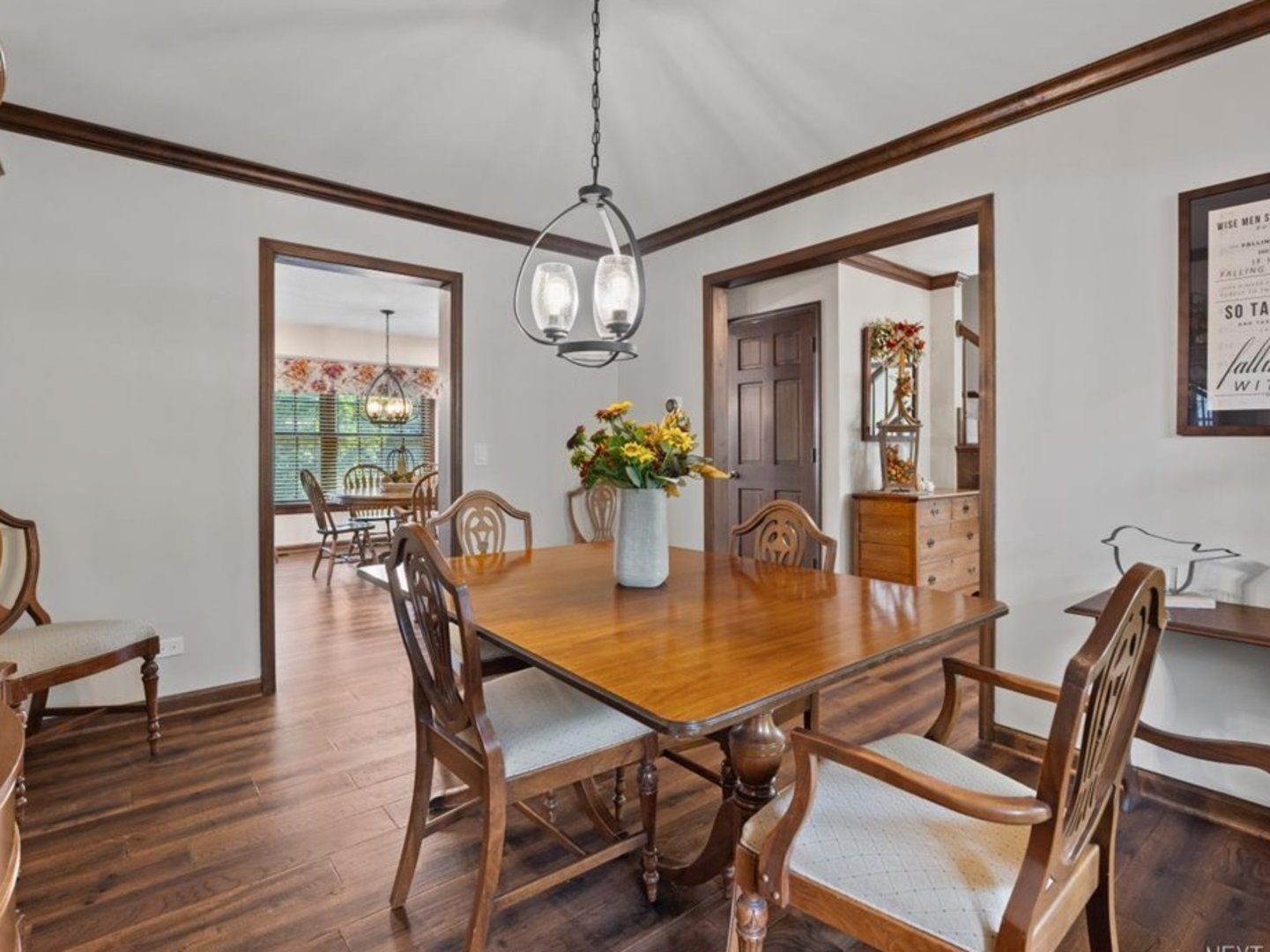 78 South Stauffer Drive Naperville, IL 60540 - Photo 8 of 31 a dining room with furniture potted plants and wooden floor