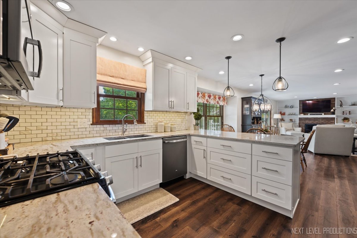 78 South Stauffer Drive Naperville, IL 60540 - Photo 10 of 31 a kitchen with stainless steel appliances granite countertop a sink stove and refrigerator