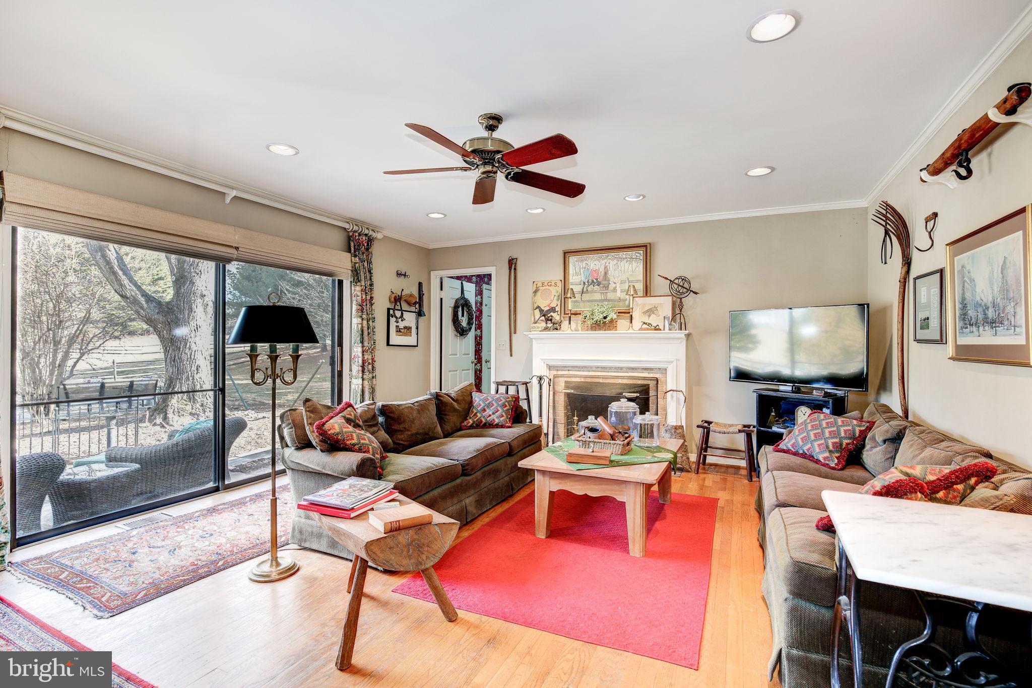 14709 Spring Meadows Drive Darnestown, MD 20874 - Photo 12 of 40 a living room with fireplace furniture and a large window