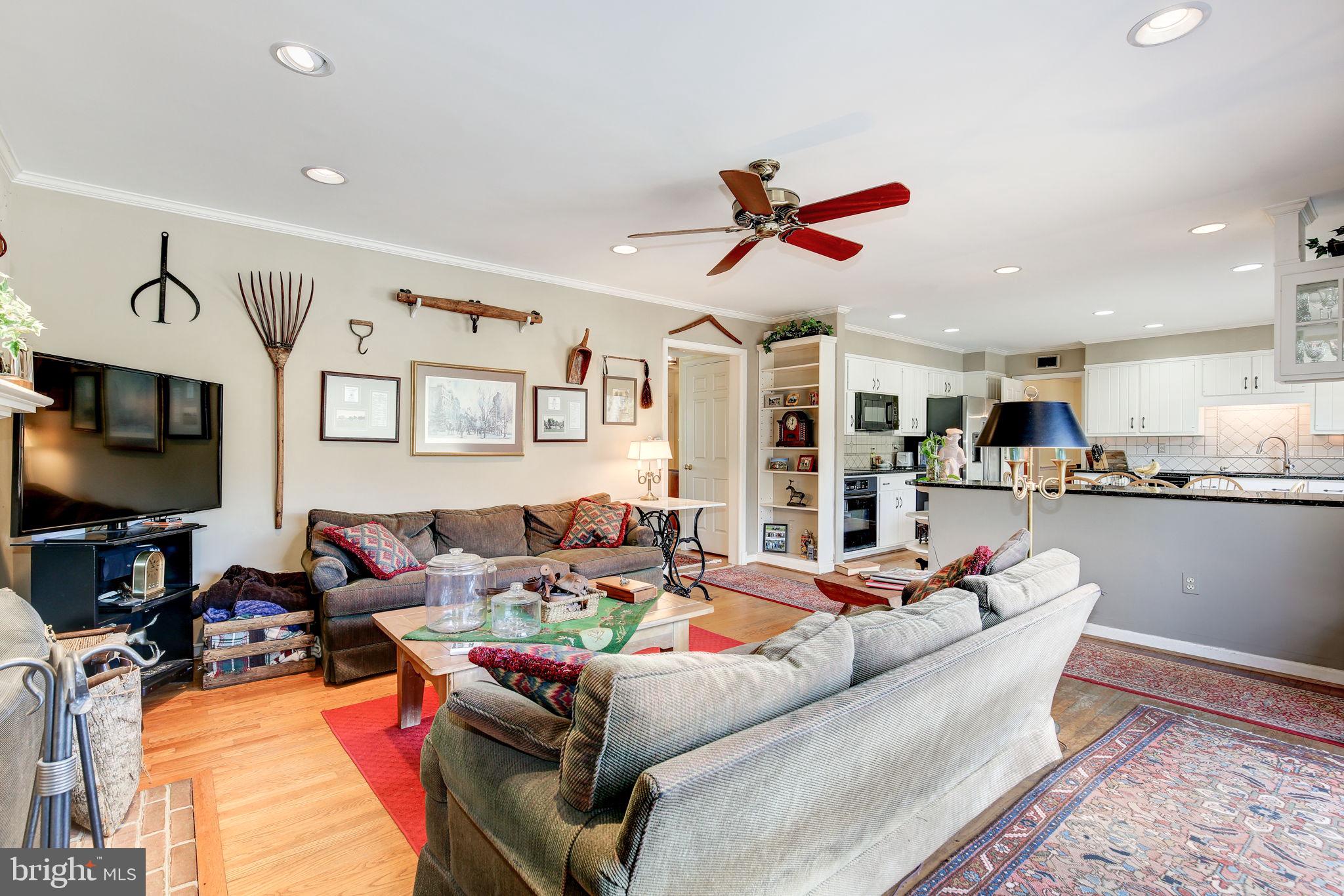 14709 Spring Meadows Drive Darnestown, MD 20874 - Photo 13 of 40 a living room with furniture kitchen view and a flat screen tv