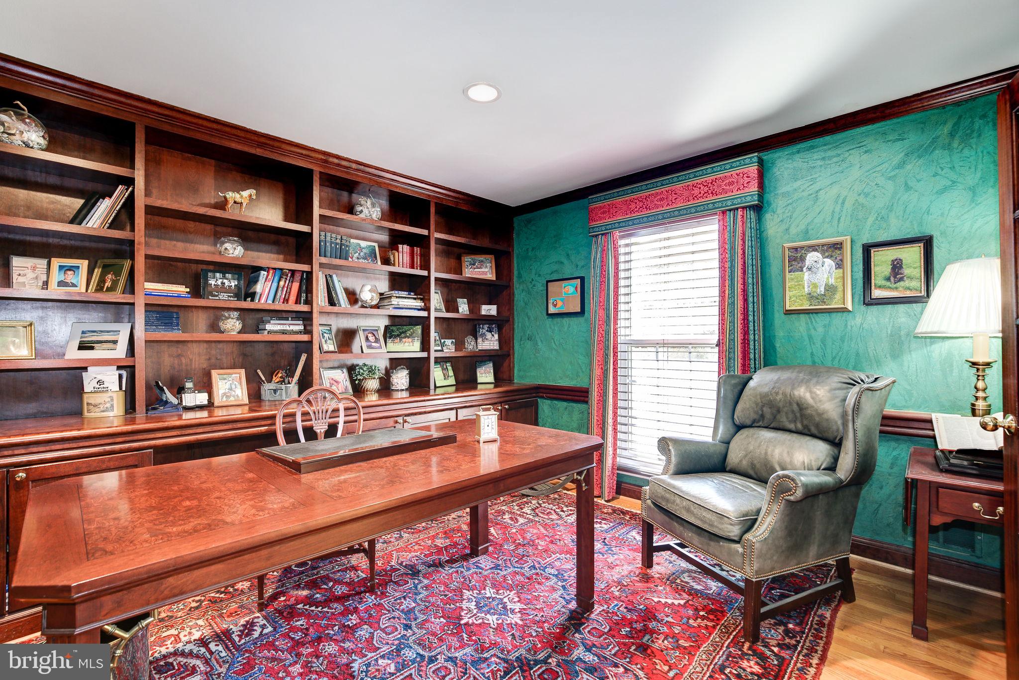 14709 Spring Meadows Drive Darnestown, MD 20874 - Photo 14 of 40 a living room with furniture and a book shelf
