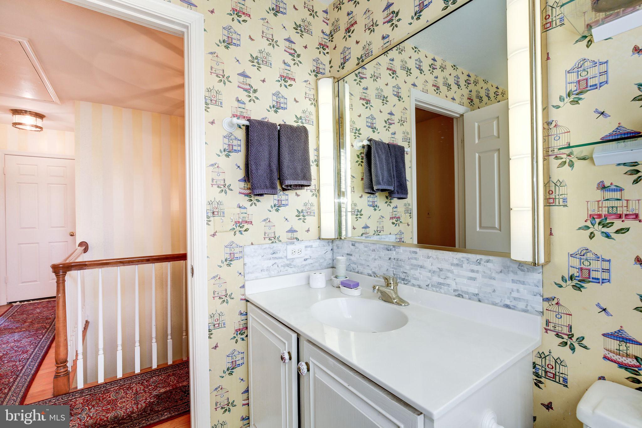 14709 Spring Meadows Drive Darnestown, MD 20874 - Photo 20 of 40 a bathroom with a sink and a mirror