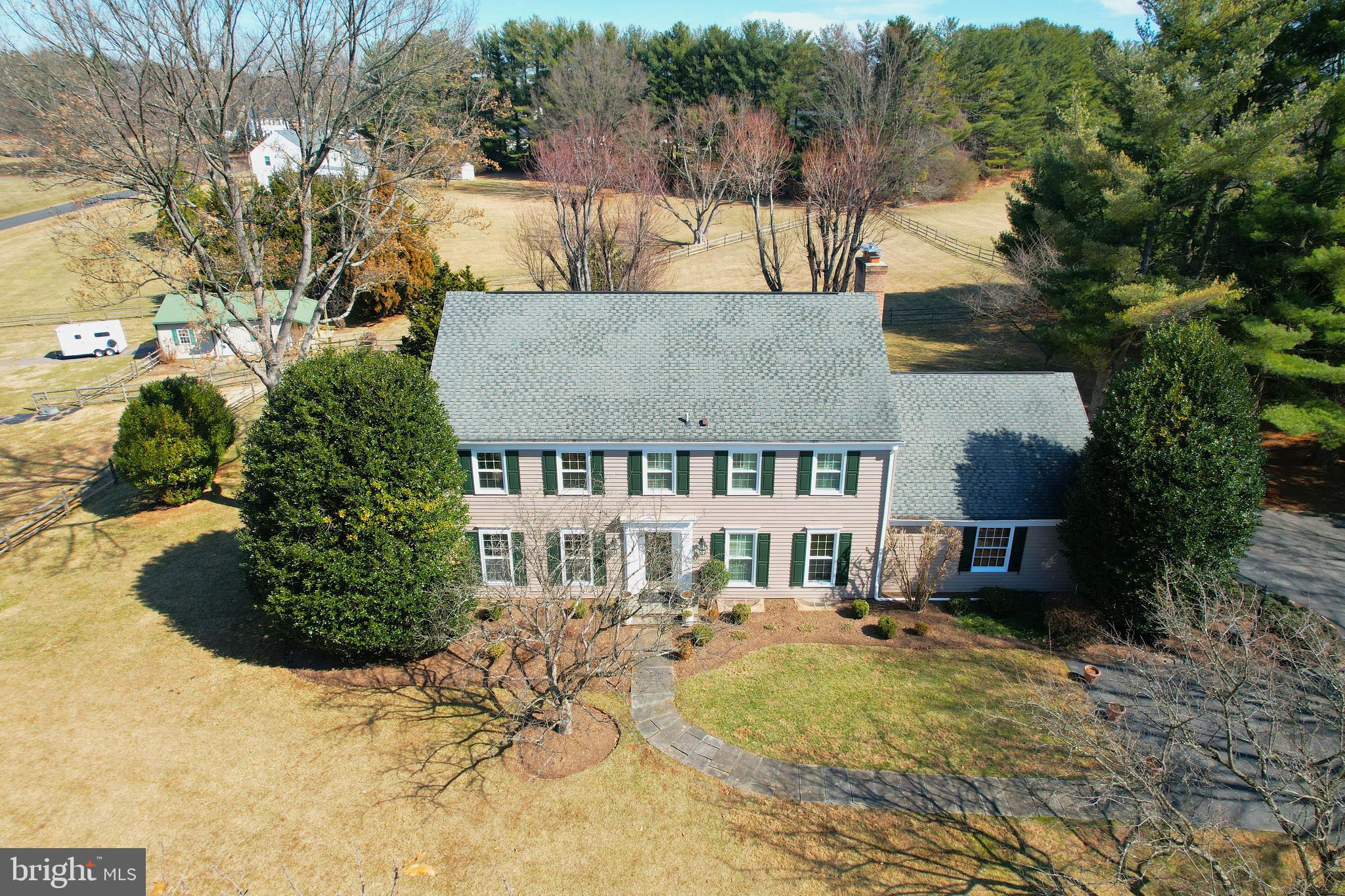 14709 Spring Meadows Drive Darnestown, MD 20874 - Photo 2 of 40 a view of a house with a yard
