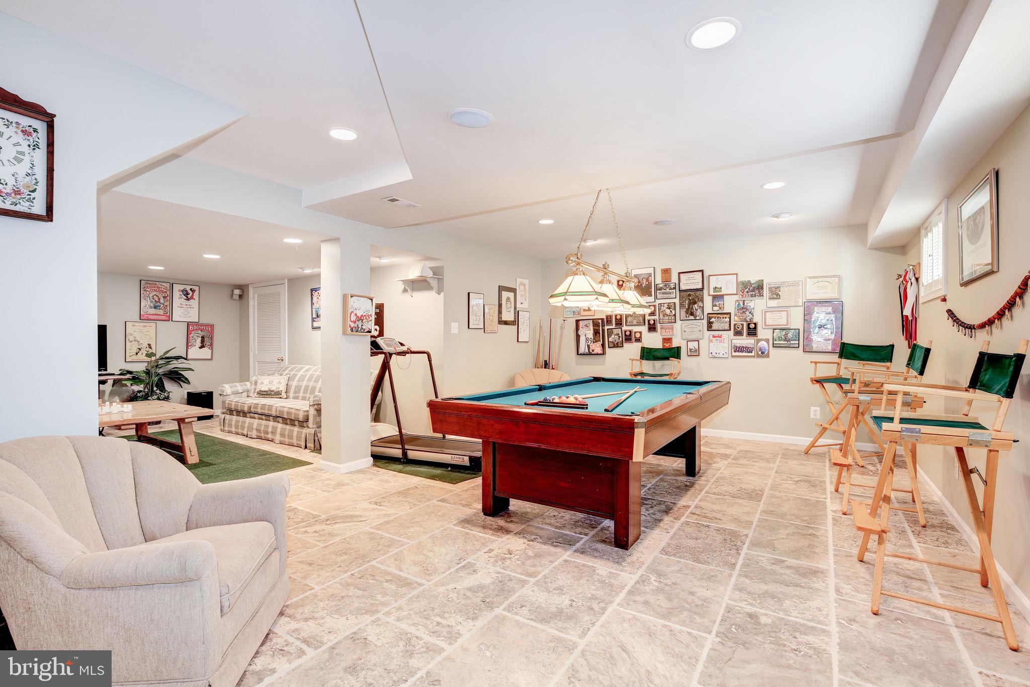 14709 Spring Meadows Drive Darnestown, MD 20874 - Photo 22 of 40 a living room with lots of furniture and a table