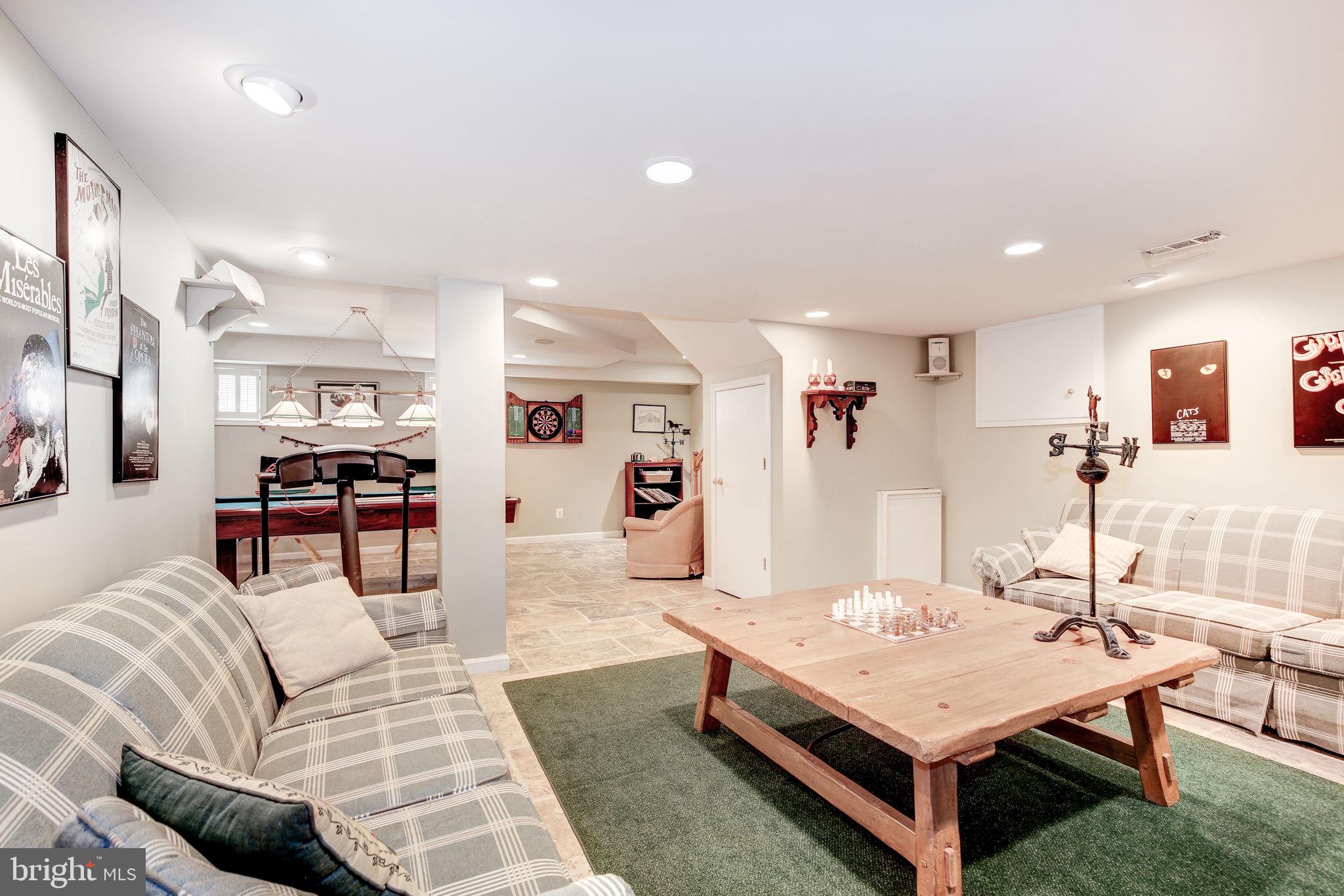 14709 Spring Meadows Drive Darnestown, MD 20874 - Photo 23 of 40 a living room with furniture and wooden table
