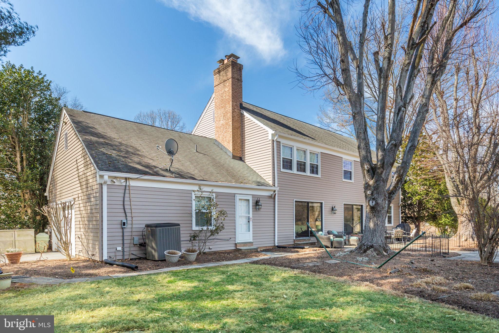 14709 Spring Meadows Drive Darnestown, MD 20874 - Photo 24 of 40 a view of a house with a yard and sitting area