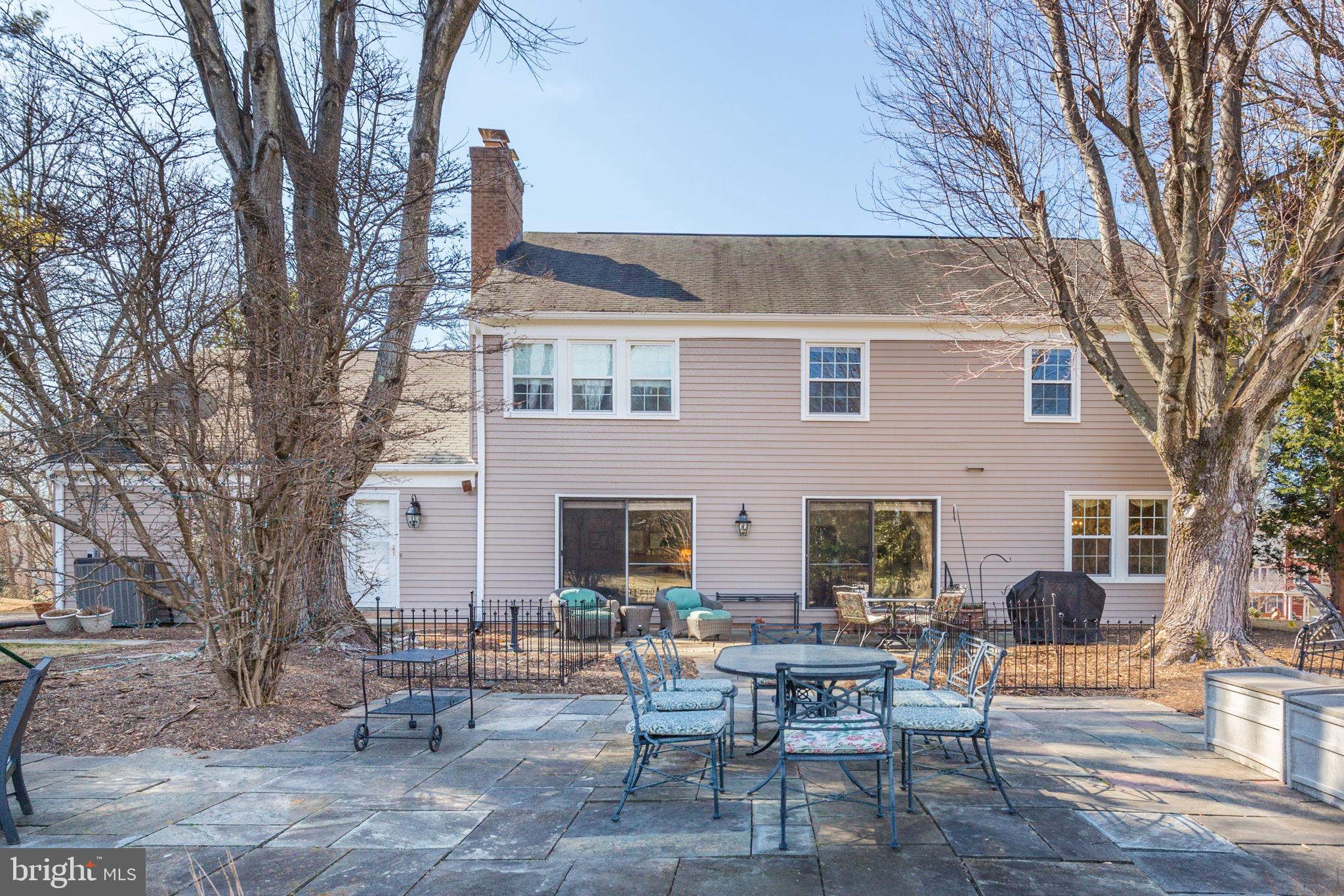 14709 Spring Meadows Drive Darnestown, MD 20874 - Photo 25 of 40 a view of backyard with outdoor seating and trees