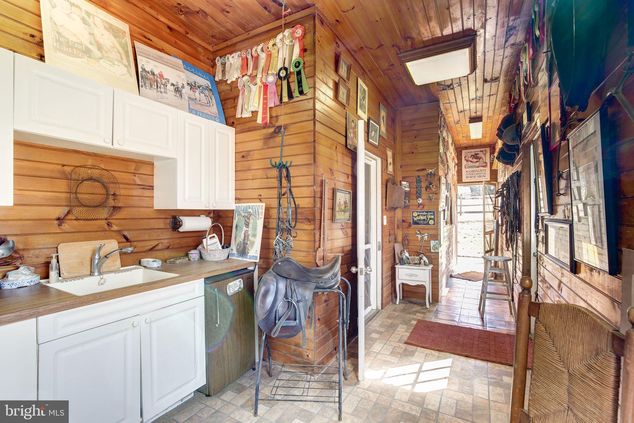 14709 Spring Meadows Drive Darnestown, MD 20874 - Photo 32 of 40 a bathroom with a sink a mirror and next to a window